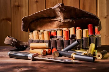 Wall murals Hunting Old hunting cartridges and bandoleer on a wooden table