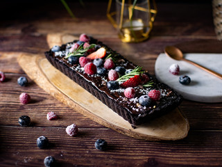 Rectangular Tart Chocolate cheesecake with fresh berries. delicious dessert for celebrate.