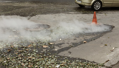 Odessa, Ukraine- Nov. 28, 2018: Accident on heating main. Burst pipes with hot water. Winter cold...