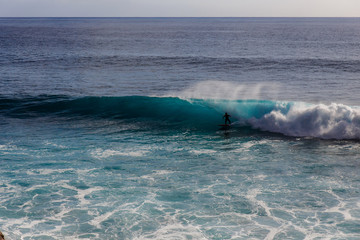 surfing on a wave near the beach