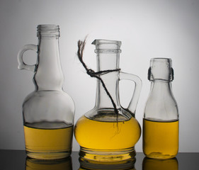 Still life with glass jars with oil. Enlightenment