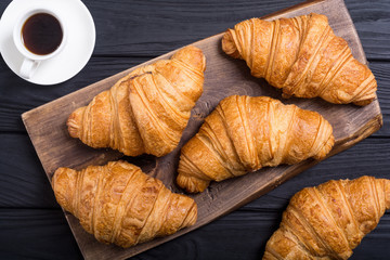 Croissants on wooden background