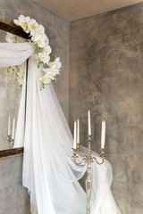 wedding vintage decor with veils, candles and orchids - vertical orientation