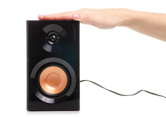 Sound speaker black in hand on a white background. Isolation