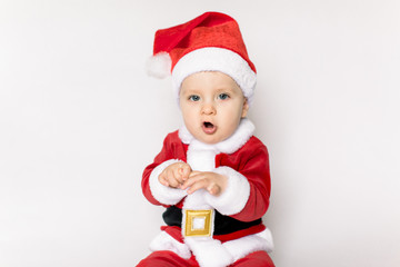 Christmas toddler in Santa hat on white background