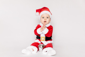 little Santa Claus sitting on the white background