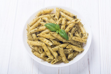 Italian penne pasta with sauce pesto