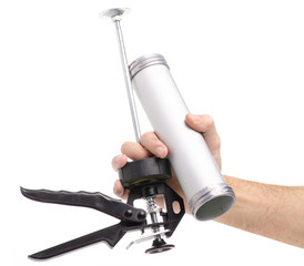 Silicone gun equipment in hand on white background isolation