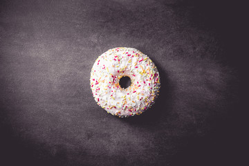 Delicious donut on black background