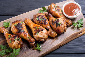 Grilled chicken legs with tomato sauce BBQ food background