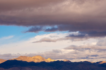 Naklejka na ściany i meble storm clouds over desert mountains