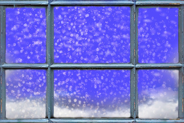 Snow falling outside the window