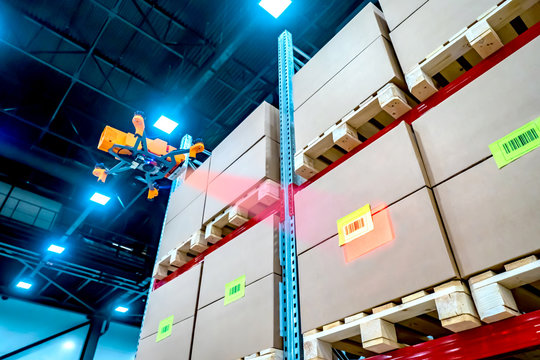 Drones scans barcode. Modern warehouse. Inventory in stock. Drone reads the barcode boxes in stock. Automation. Storage management. Responsible storage. Warehouse inspection.