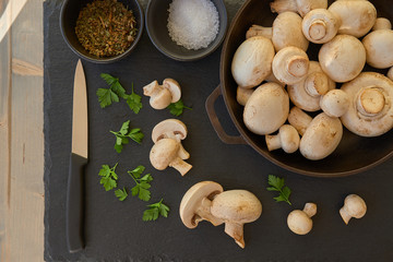 Champignon mushrooms in a cast iron skillet