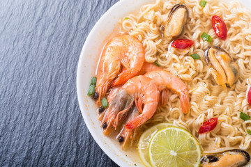 Instant noodles soup with shrimps and mssels . Asian food