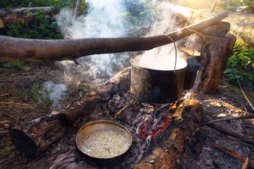 Deurstickers kettle on a fire © Sergii Mostovyi