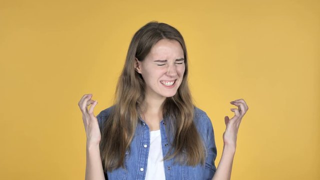 Screaming Angry Pretty Woman Isolated on Yellow Background