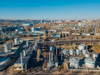 Chemical factory industrial area. Aerial view. Large vats connected by pipeline 
