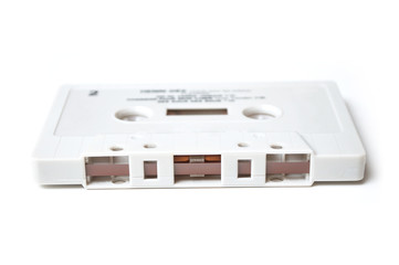 closeup of vintage audio cassette on white background