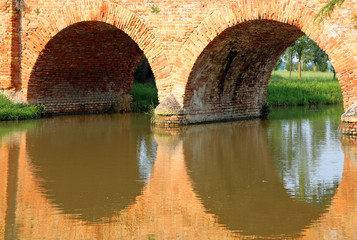 bridge made of bricks with arches