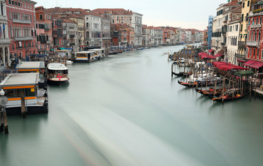 Passenger boat sailing on the Grand Canal in Venice in Italy Pho