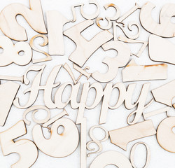 chaotic background of numbers from zero to nine and spell Happy. Background with numbers. Textures of numbers