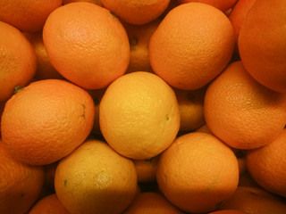 Fresh mandarin citrus fruits on a market stand