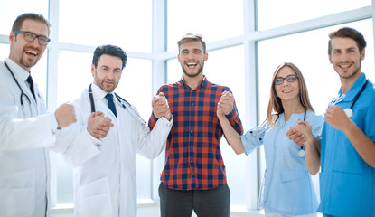 successful medical team with a patient