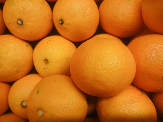 Fresh mandarin citrus fruits on a market stand