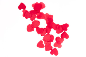 scattered red hearts on a white background. Excellent background to the day of Saint Valentine.copy space
