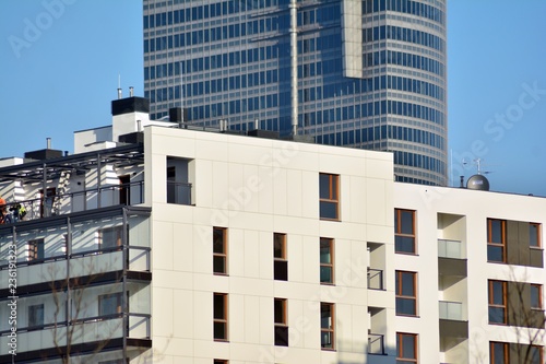 Modern Apartment Buildings On A Sunny Day With Blue Sky Facade Of Modern Apartment Buildings On A Sunny Day With Blue Sky Facade Of