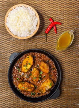 Tasty Bengali food dishes with basmati rice and Kerala fish curry.

