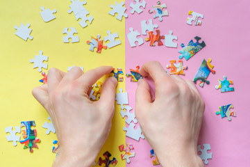 overhead view of hands solving puzzle flat lay f