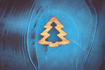 Christmas motif, hand carved Christmas tree on ice