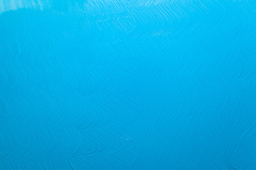 Fototapeta na wymiar bright blue surface with paint strokes, background, texture