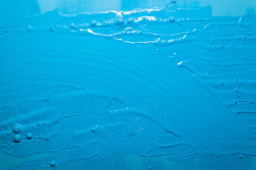 bright blue surface with paint strokes, background, texture