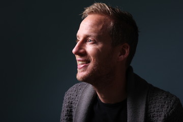 Portrait of a man in front of a colored background