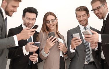 group of business people reading a message on phones