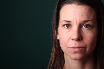 Portrait of a woman in front of a colored background