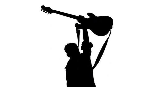 Silhouette of male bass player on music festival stage thanking fans