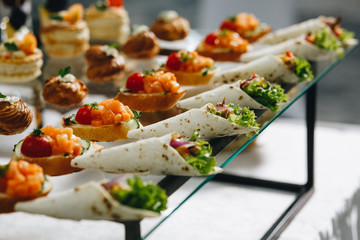 Delicious canapes as event dish in luxary restaurant. - obrazy, fototapety, plakaty