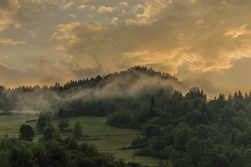 Orange sunset after storm in Lesnica village in Pieniny national park © luzkovyvagon.cz