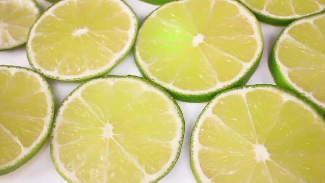 Green lemon lime fruit slices looping texture pattern closeup video