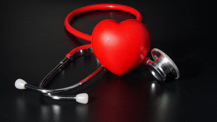 Red heart and a stethoscope isolated, healthy and care concept