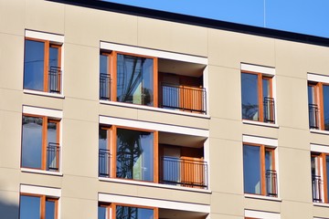 Modern apartment buildings on a sunny day with a blue sky. Facade of a modern apartment building