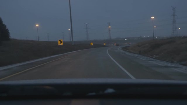 Driving on wet, winter evening. Off-ramp from Express Toll Route Highway 407, merging with Hwy 404 going south in Toronto, Canada.