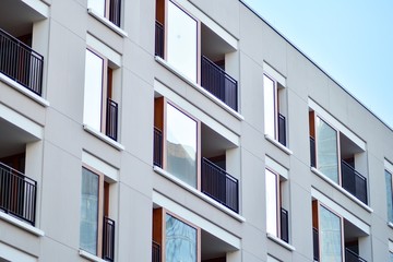 Modern apartment buildings on a sunny day with a blue sky. Facade of a modern apartment building