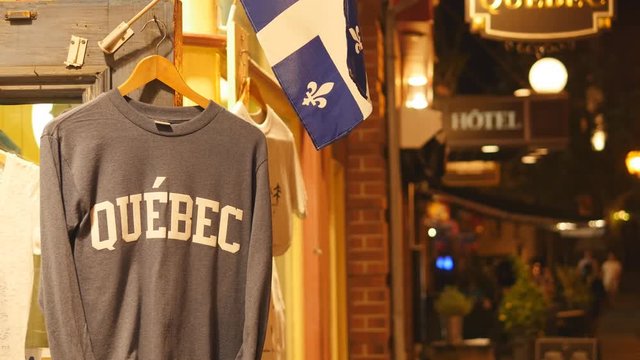 Quebec shirt and flag outside tourist shop. Quebec City, Canada.