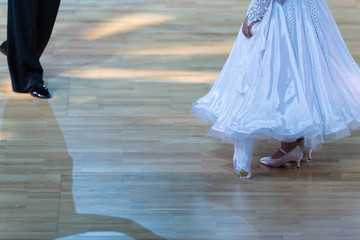 Closeup of Feet and Legs of Professional Ballroom Dance Couple Prior to Performing Youth Standard...