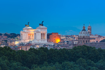Aerial wonderful view of Rome with Altar of the Fatherland and churches at night in Rome, Italy